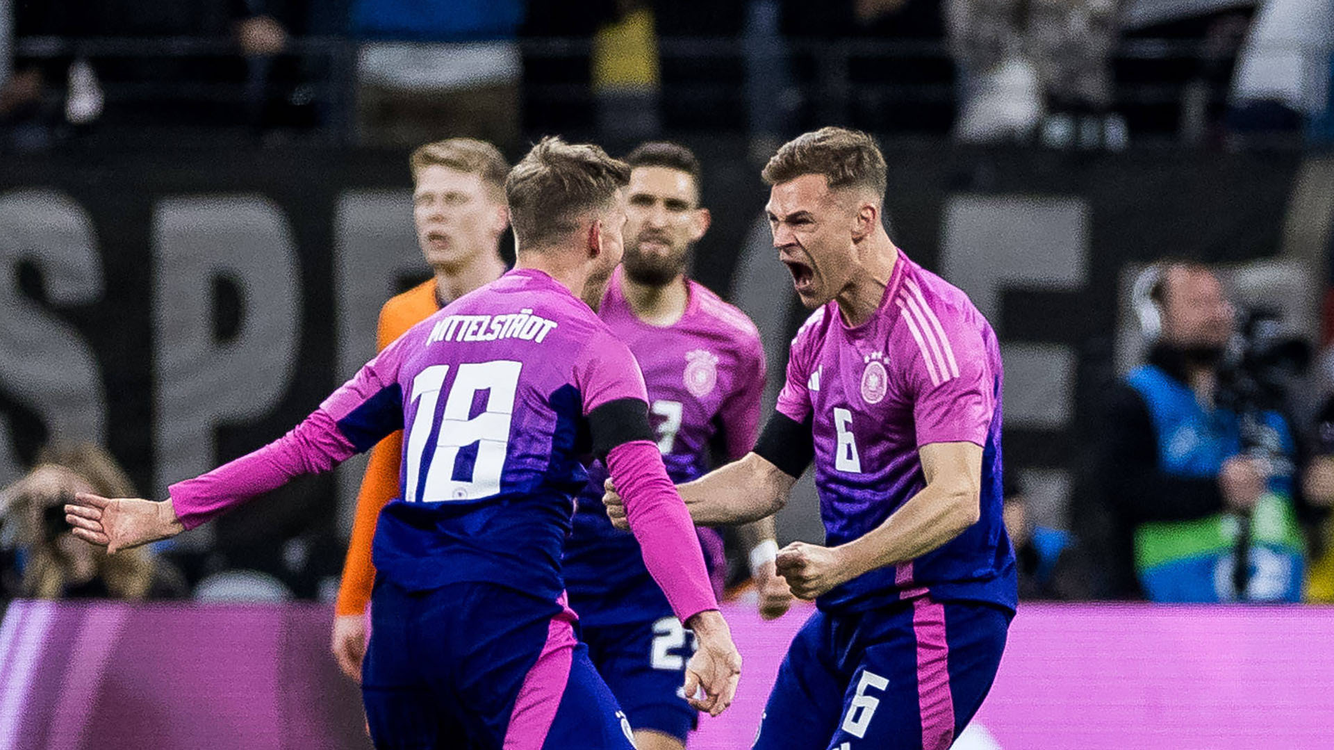 Joshua Kimmich celebrates with Maximilian Mittelstädt after his equaliser.