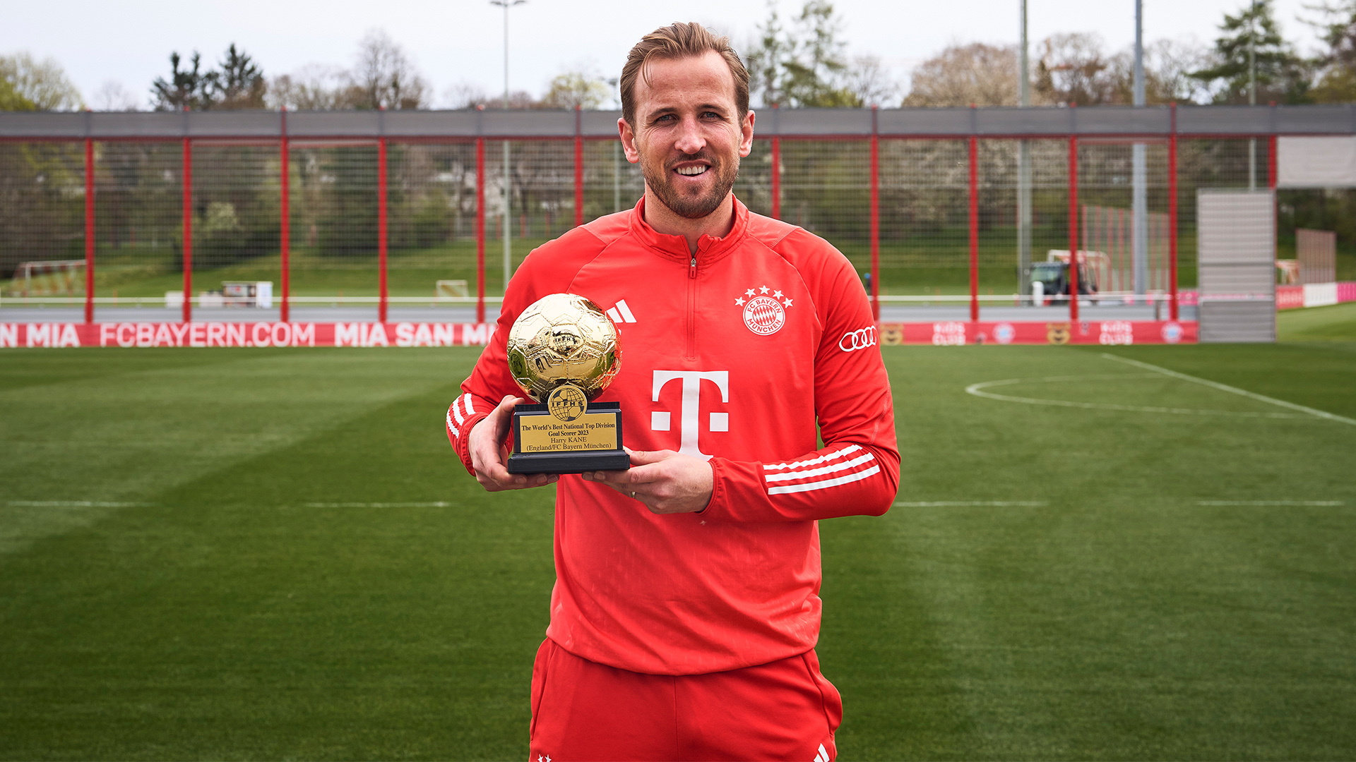 Harry Kane with his IFFHS award for the top goalscorer in 2023