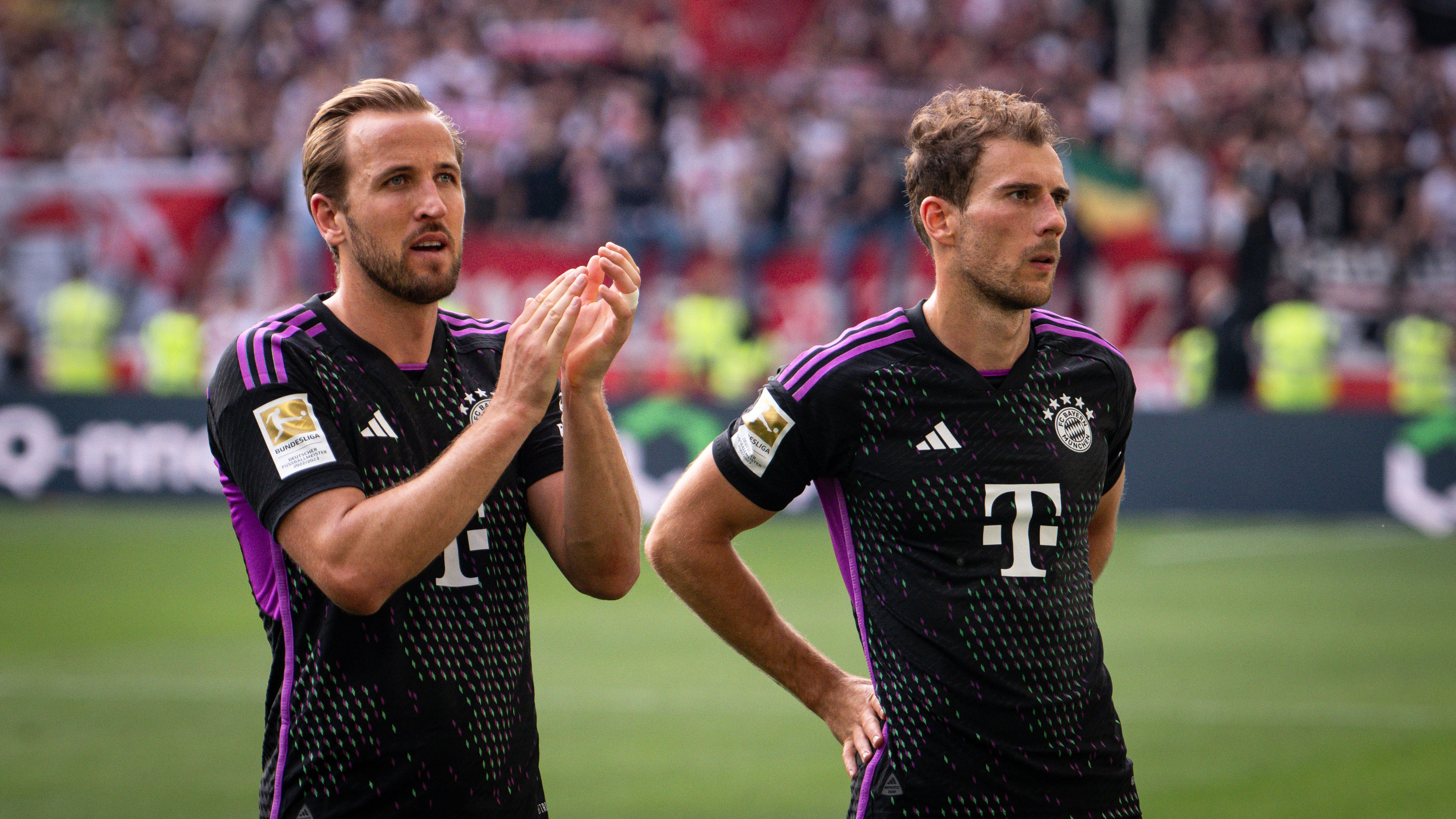 Harry Kane and Leon Goretzka salute the fans after the final whistle