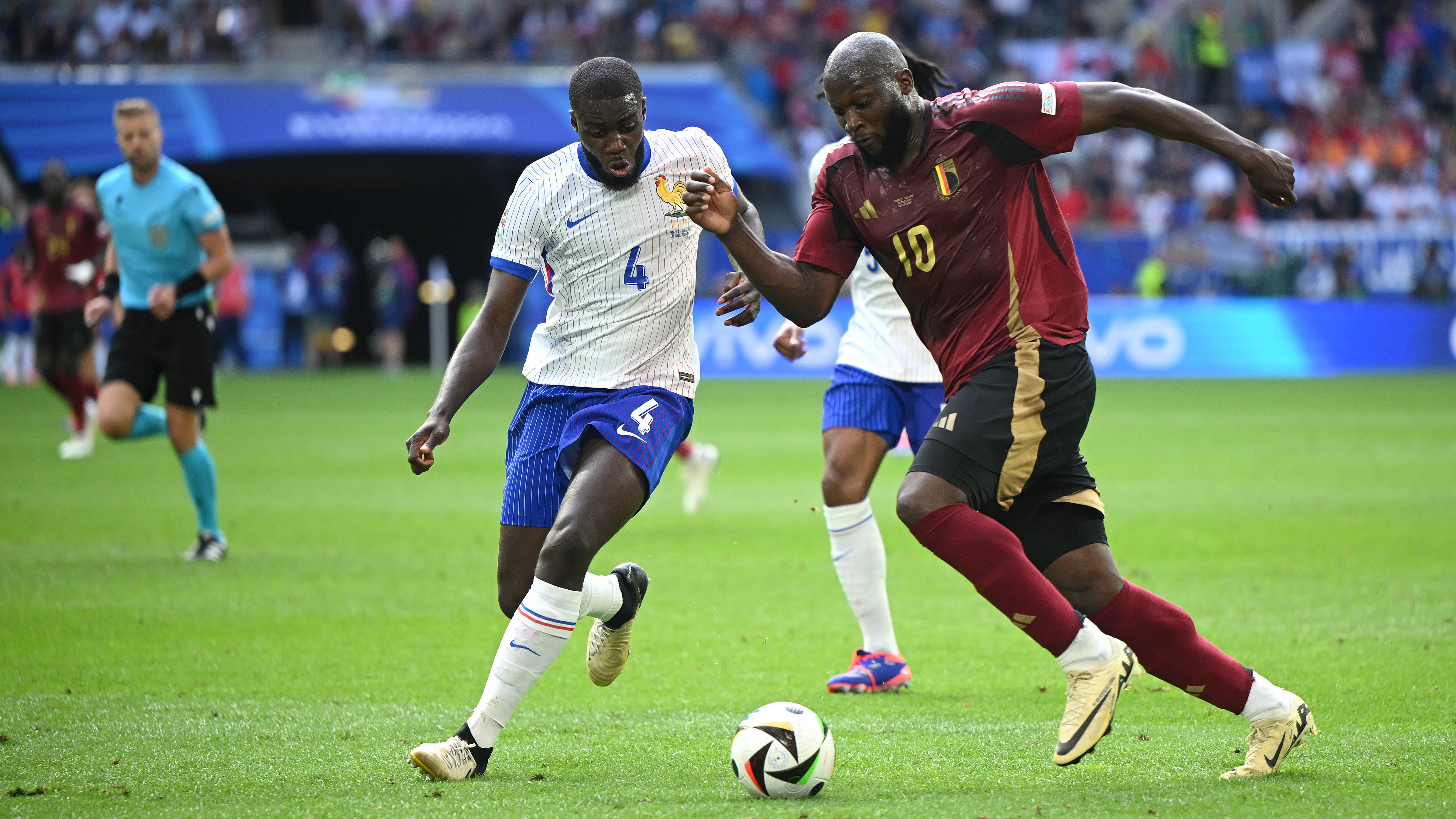 Dayot Upamecano in a duel with Belgium's Romelu Lukaku.