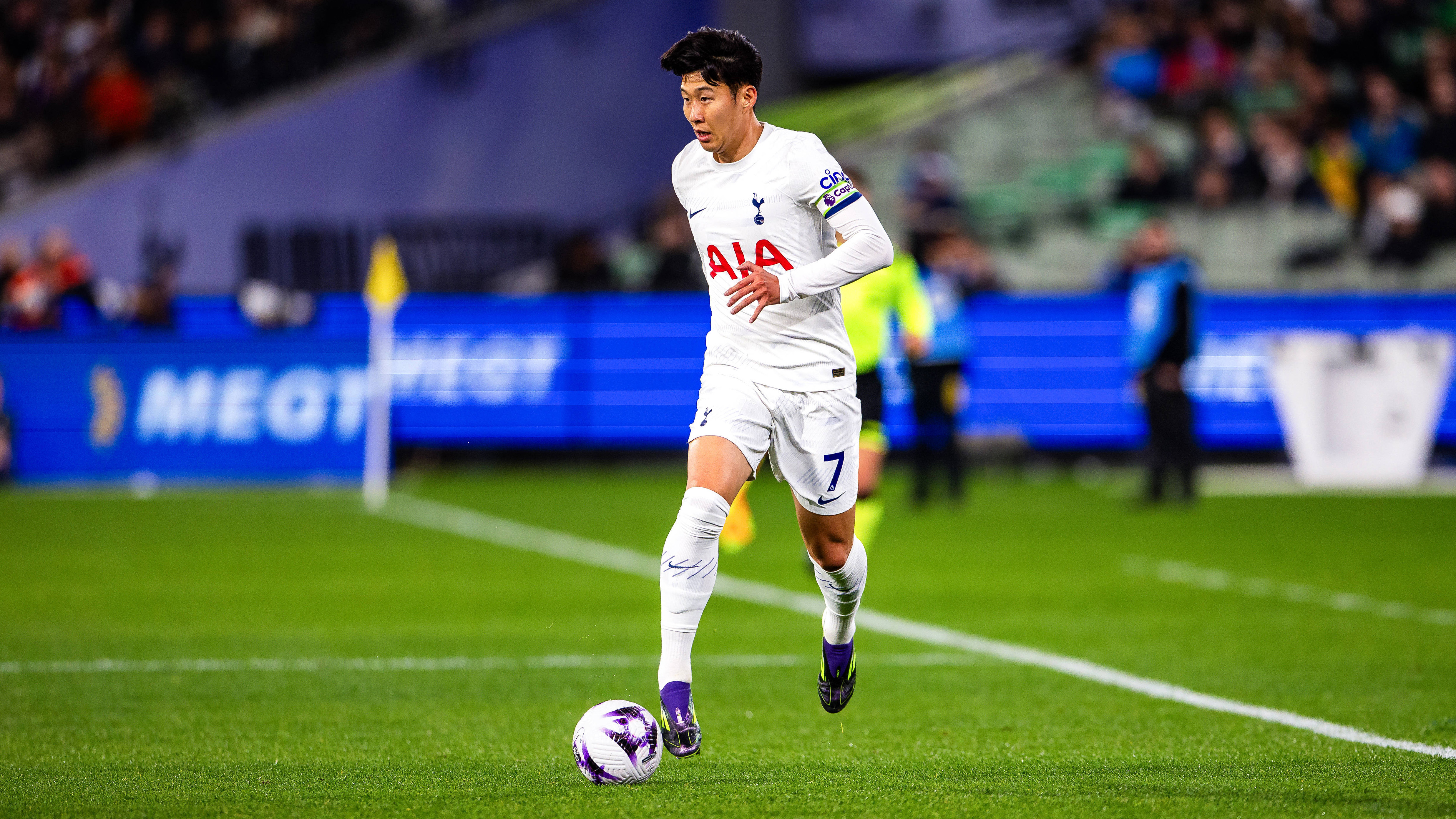 Tottenham forward Heung-min Son dribbles with the ball.