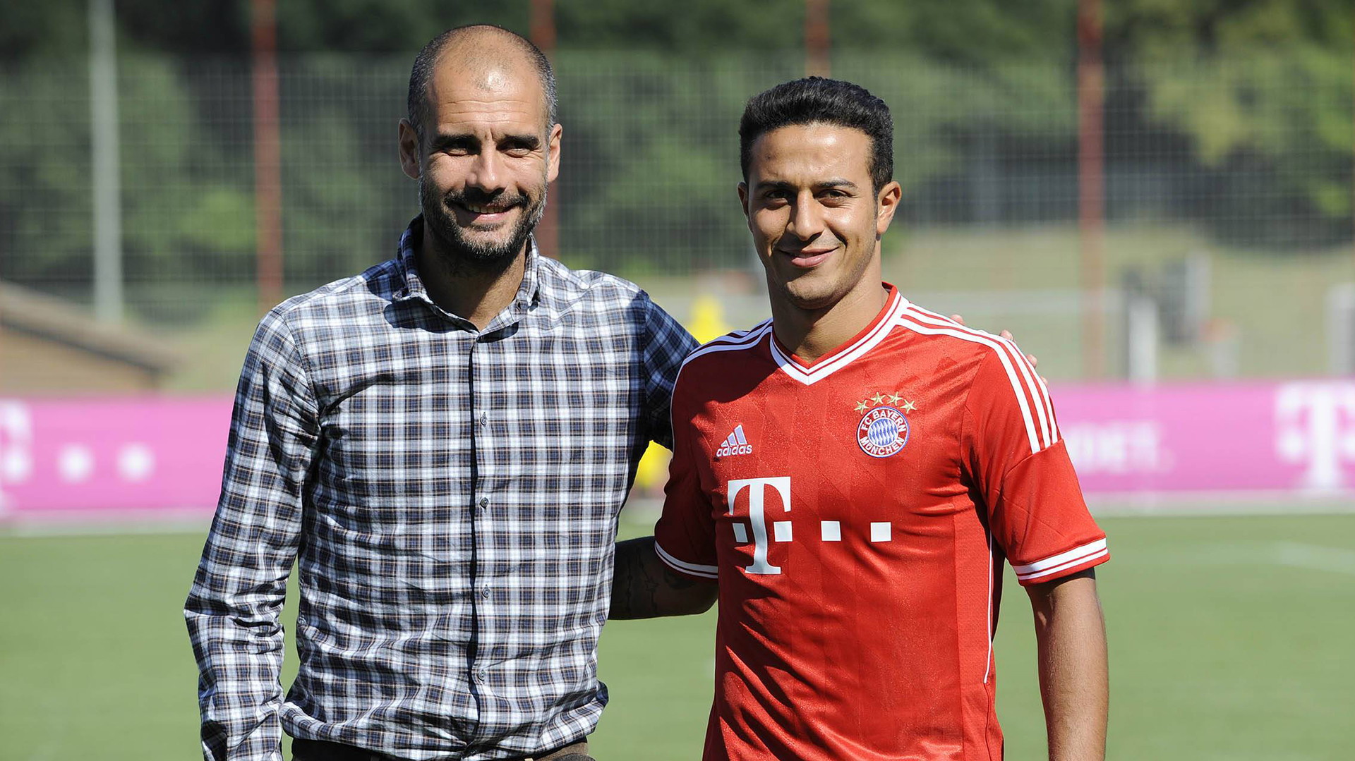 Thiago alongside Pep Guardiola after signing for Bayern.