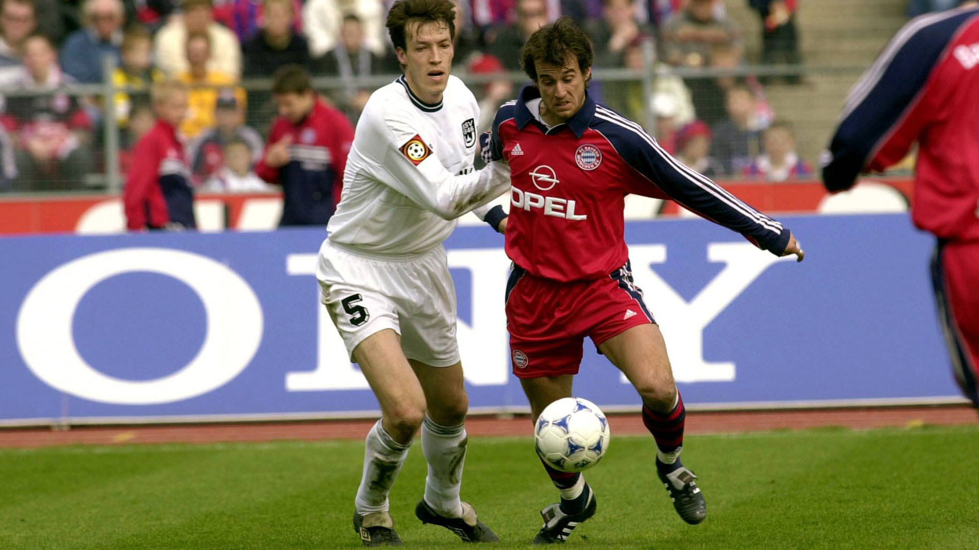 FC Bayern's Mehmet Scholl in a tussle with Uwe Grauer from SSV Ulm.