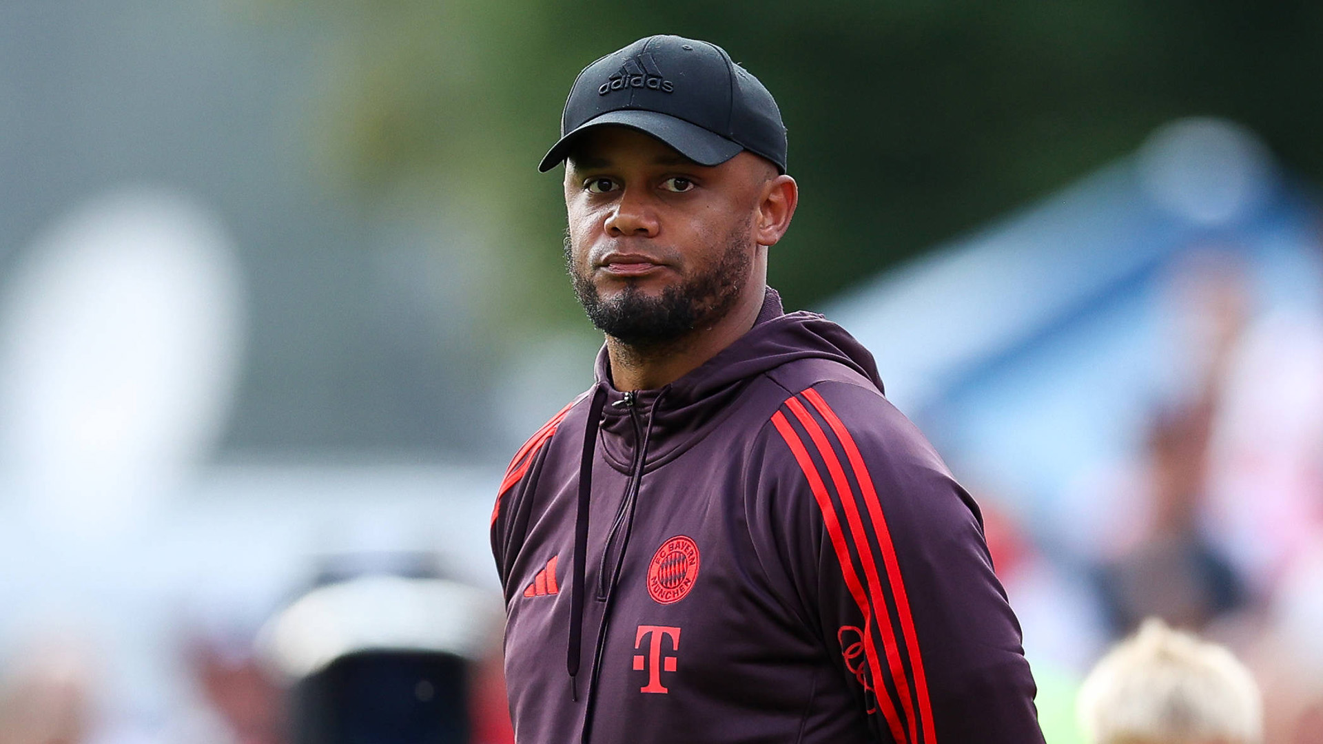 Coach Vincent Kompany stands on the touchline during an FC Bayern friendly.