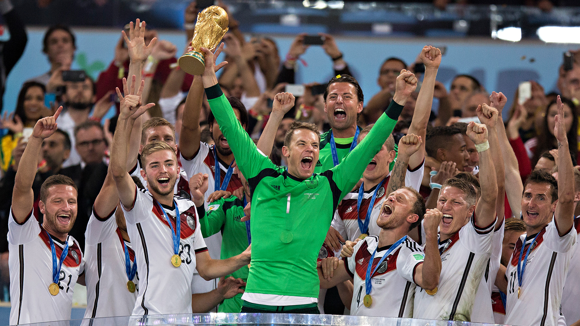 Manuel Neuer celebrates with the World Cup trophy