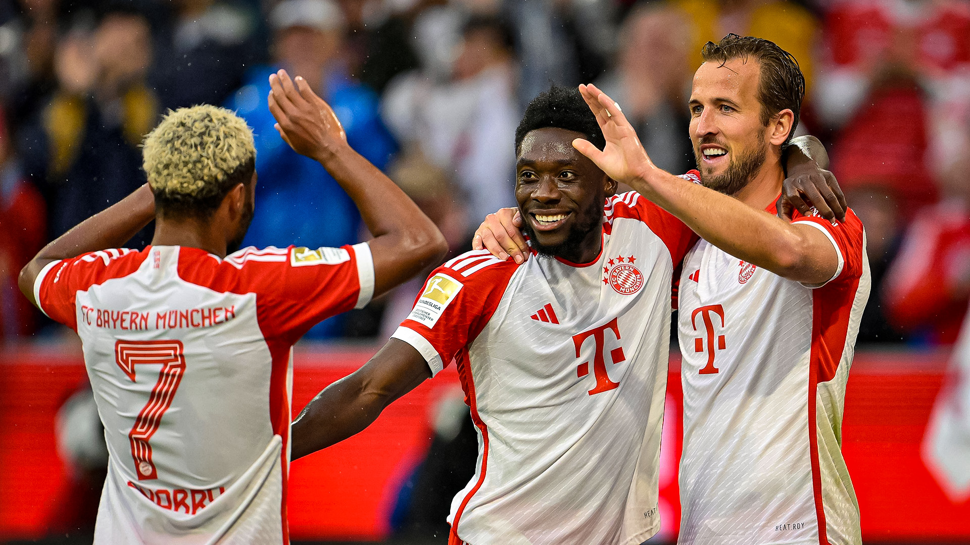 Harry Kane, Alphonso Davies and Serge Gnabry celebrating a goal against Augsburg.