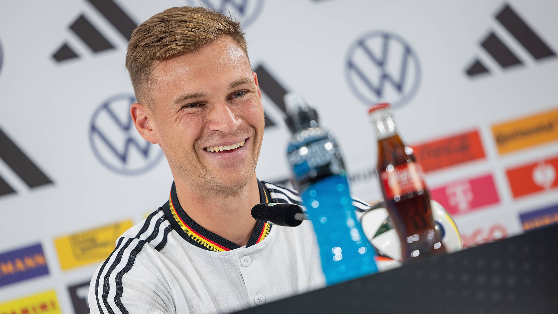 Joshua Kimmich on the podium at a Germany press conference