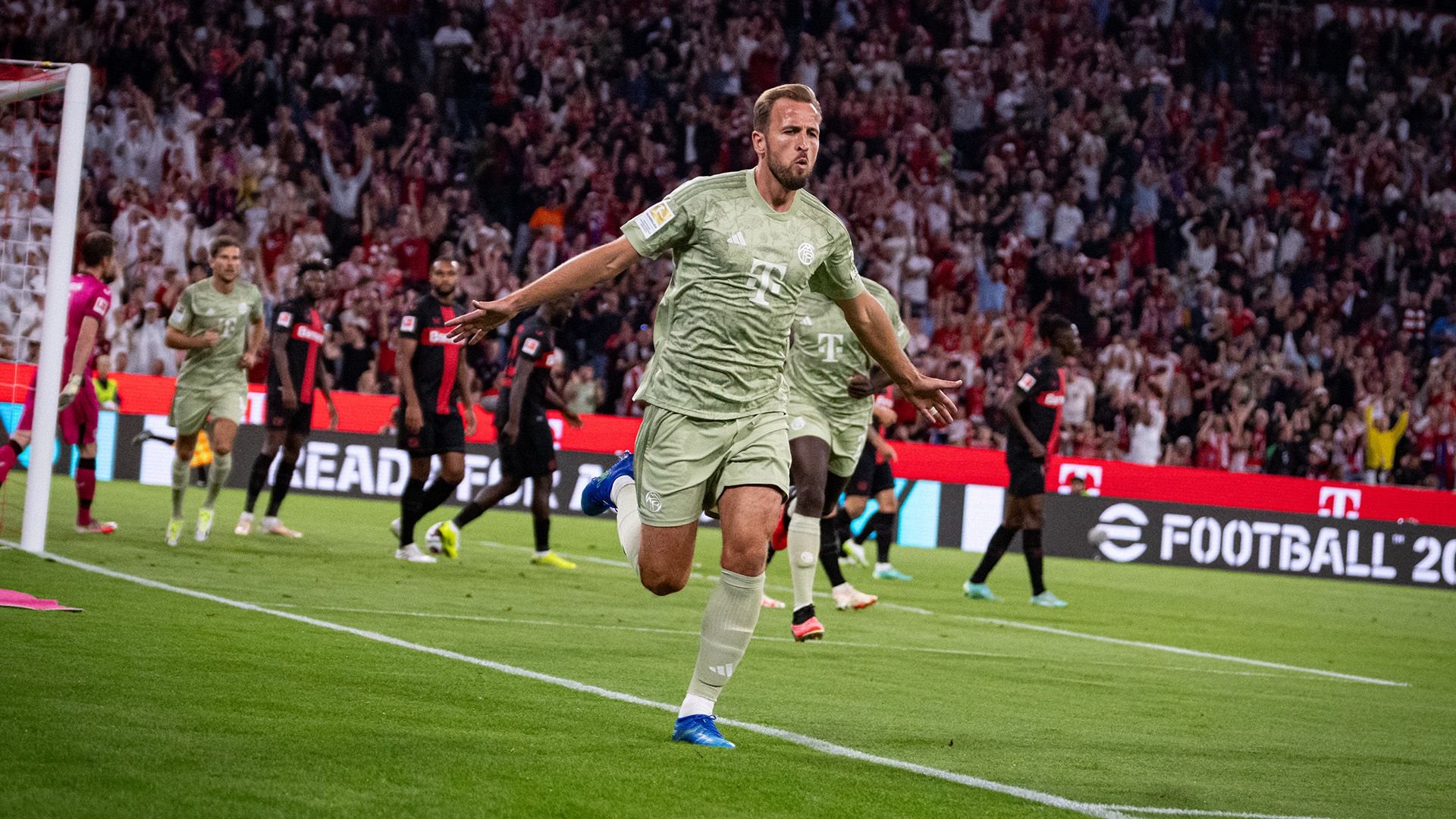 Harry Kane of FC Bayern celebrates his goal against Bayer 04 Leverkusen