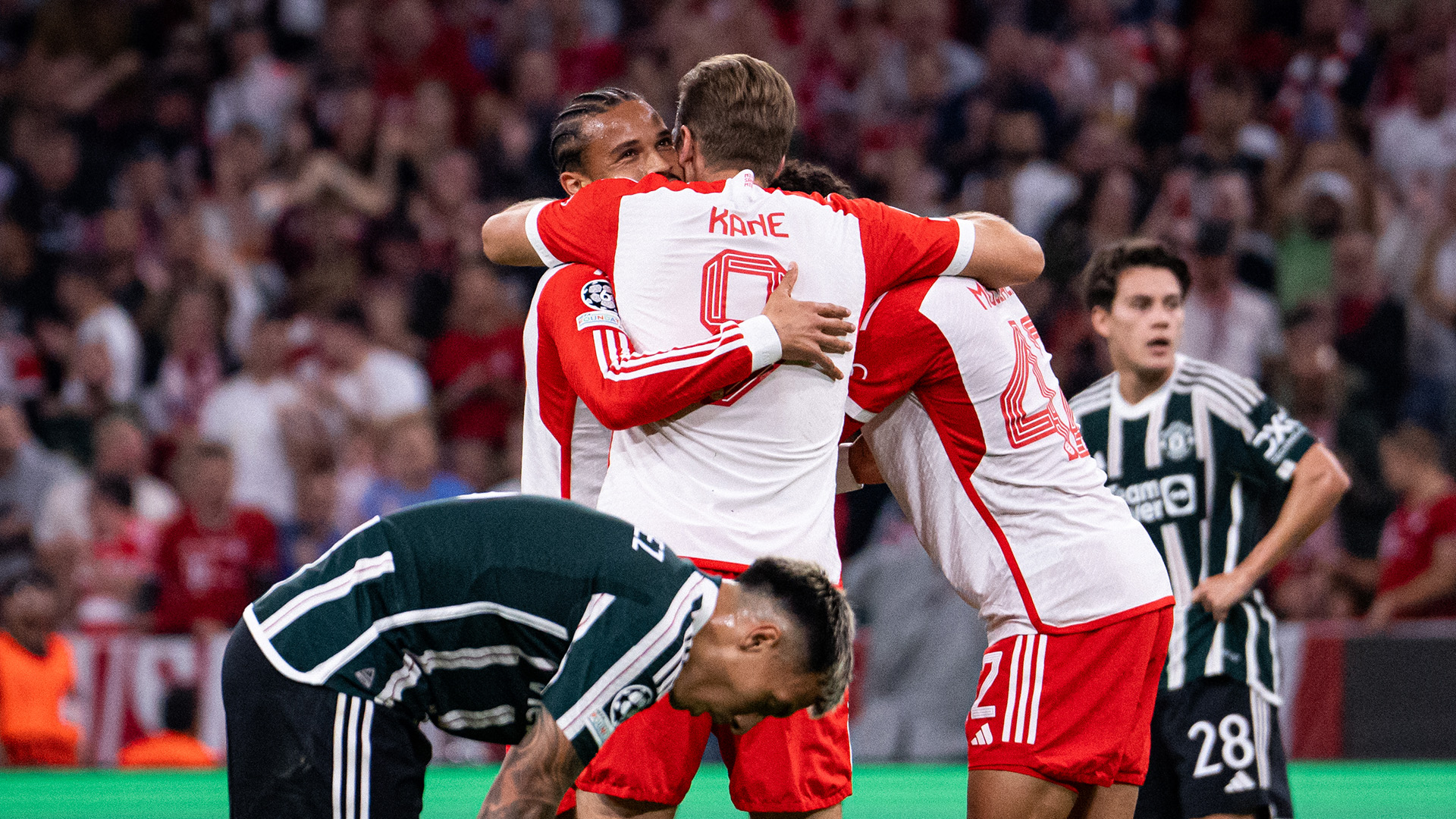 Harry Kane and Leroy Sané celebrate an FC Bayern goal against Manchester United.