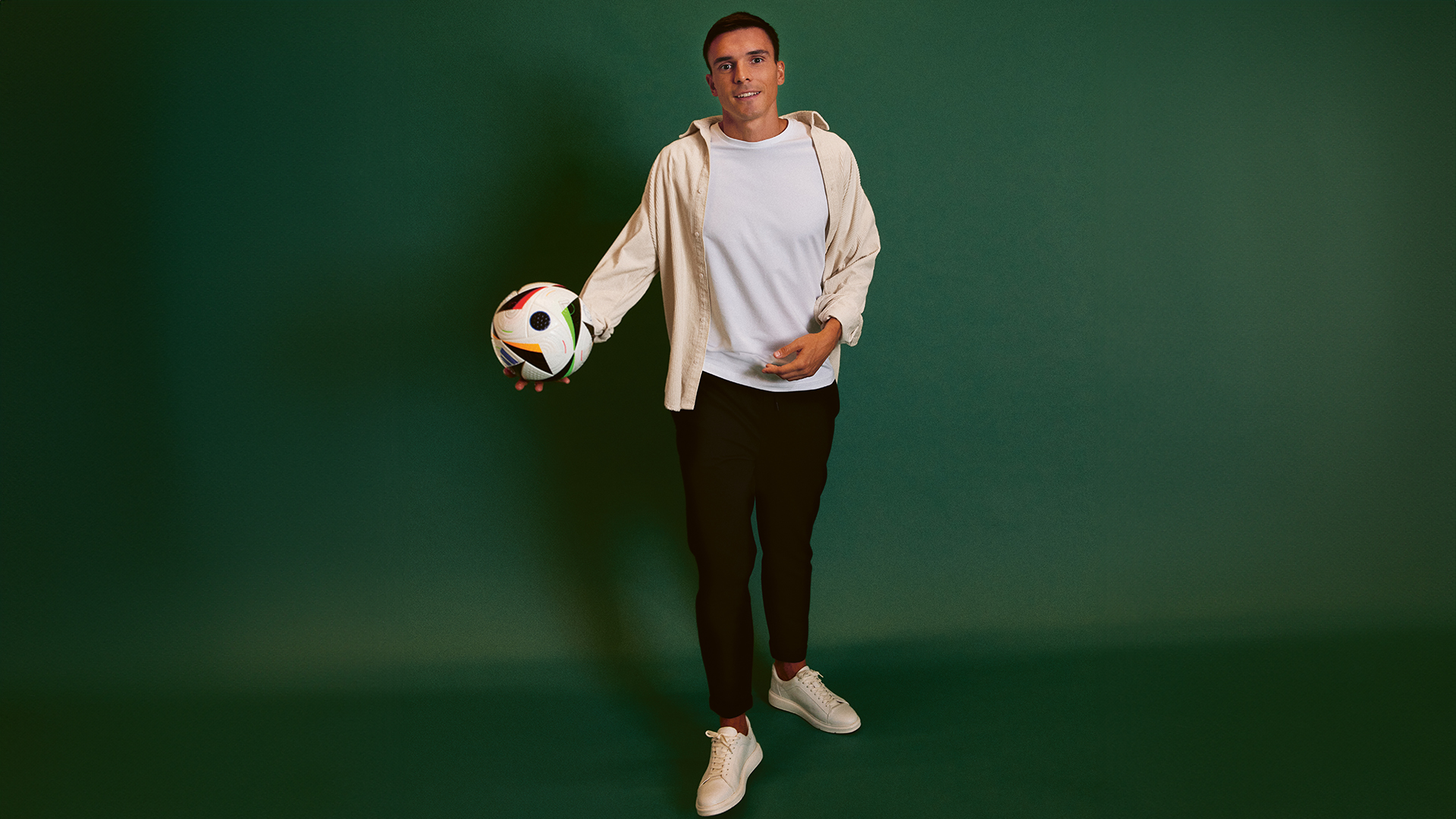 Joao Palhinha holding a football