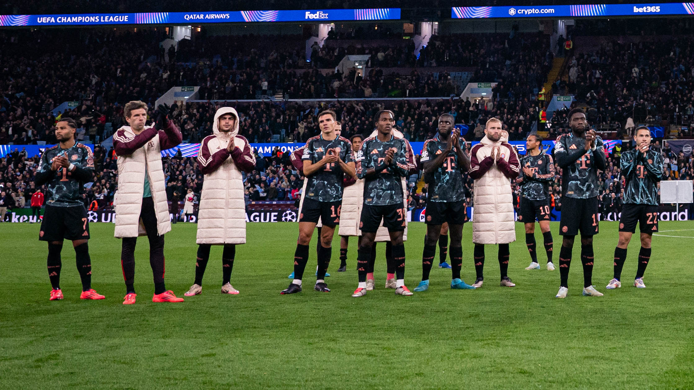 The FC Bayern players in front of the visiting fans at Aston Villa