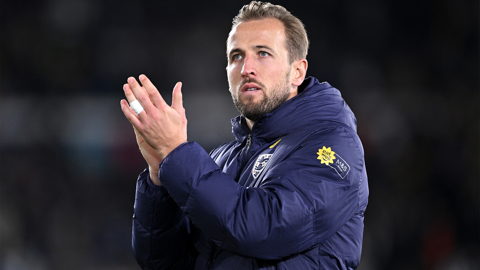 Harry Kane applauds the fans after England's victory in Finland