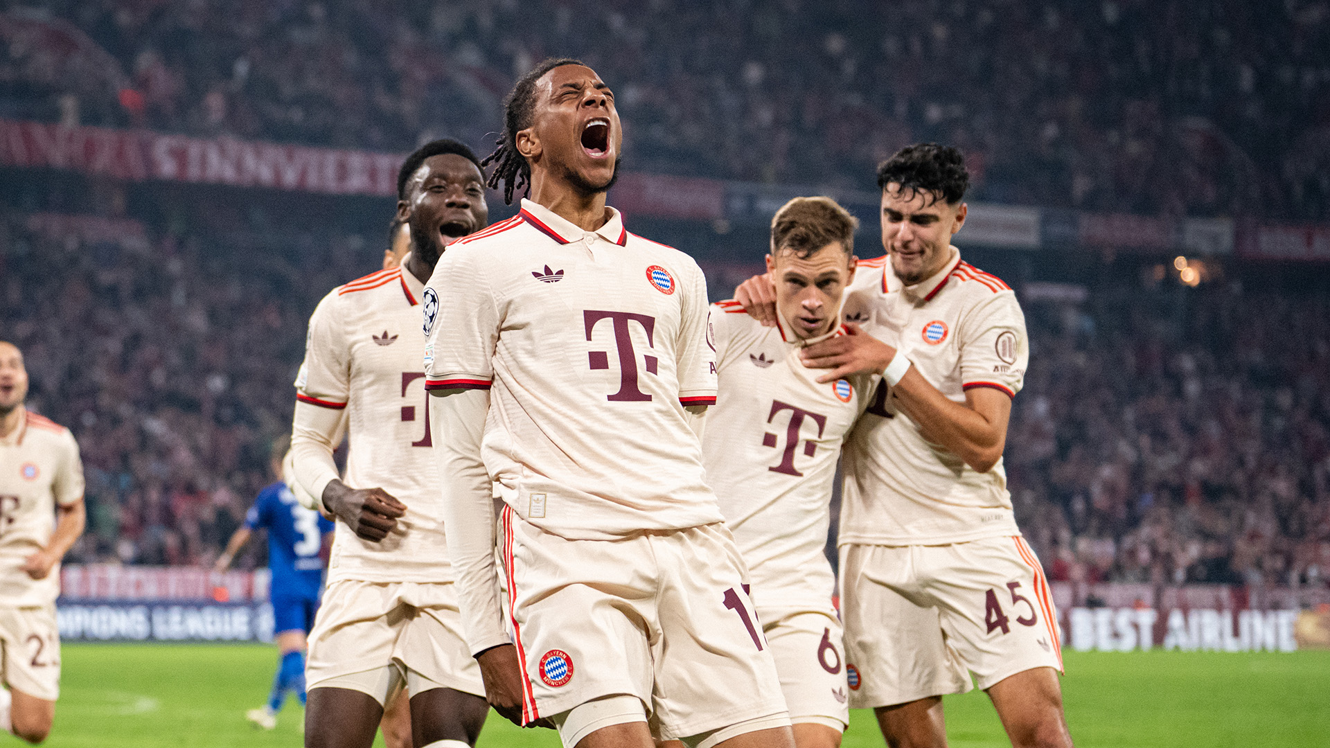 Michael Olise celebrates a goal in his first Champions League game.