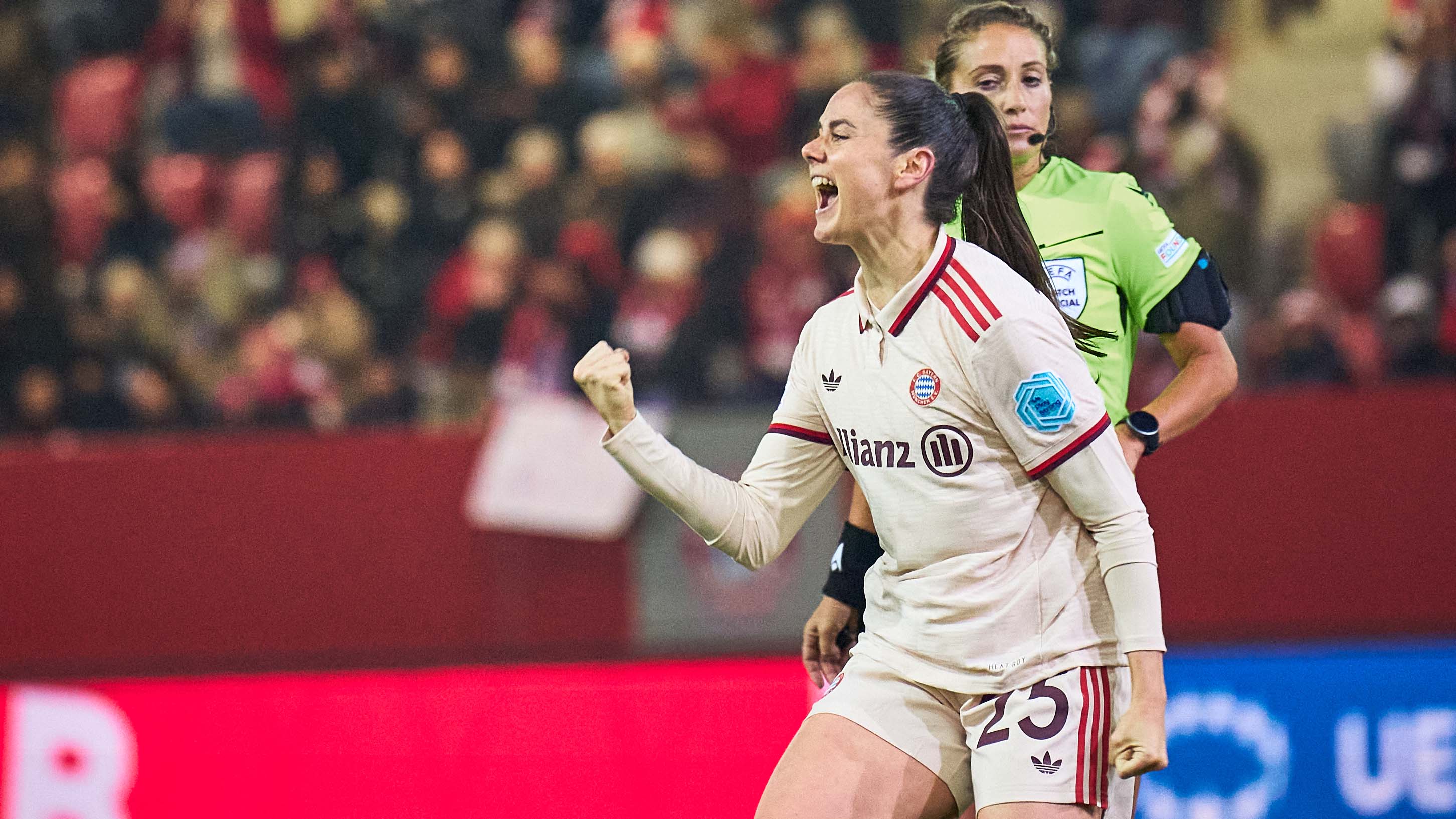 Sarah Zadrazil celebrates with a clenched fist after scoring a goal.