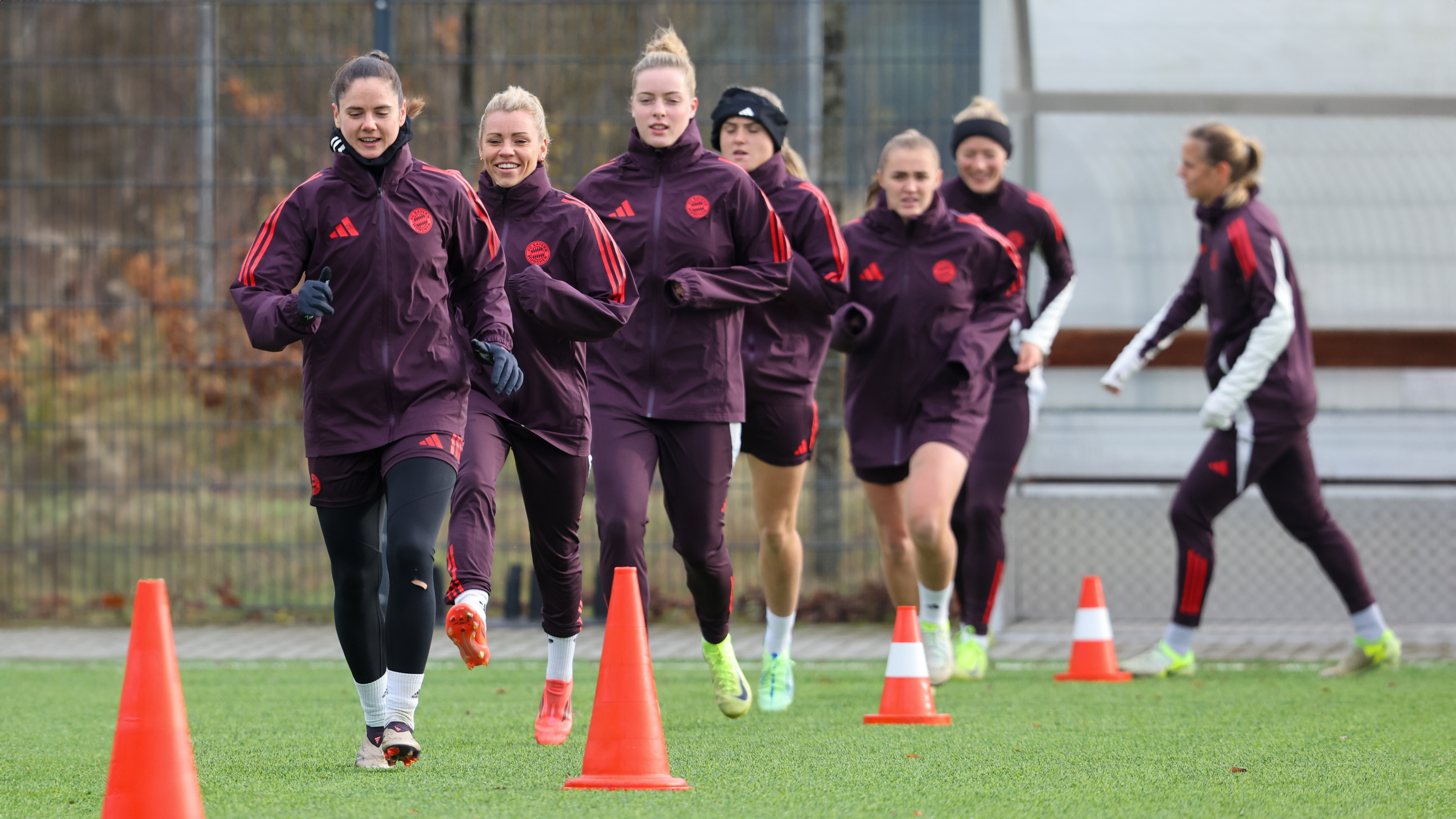 Sarah Zadrazil and Linda Dallmann lead the squad on a run during an FC Bayern Women training session.