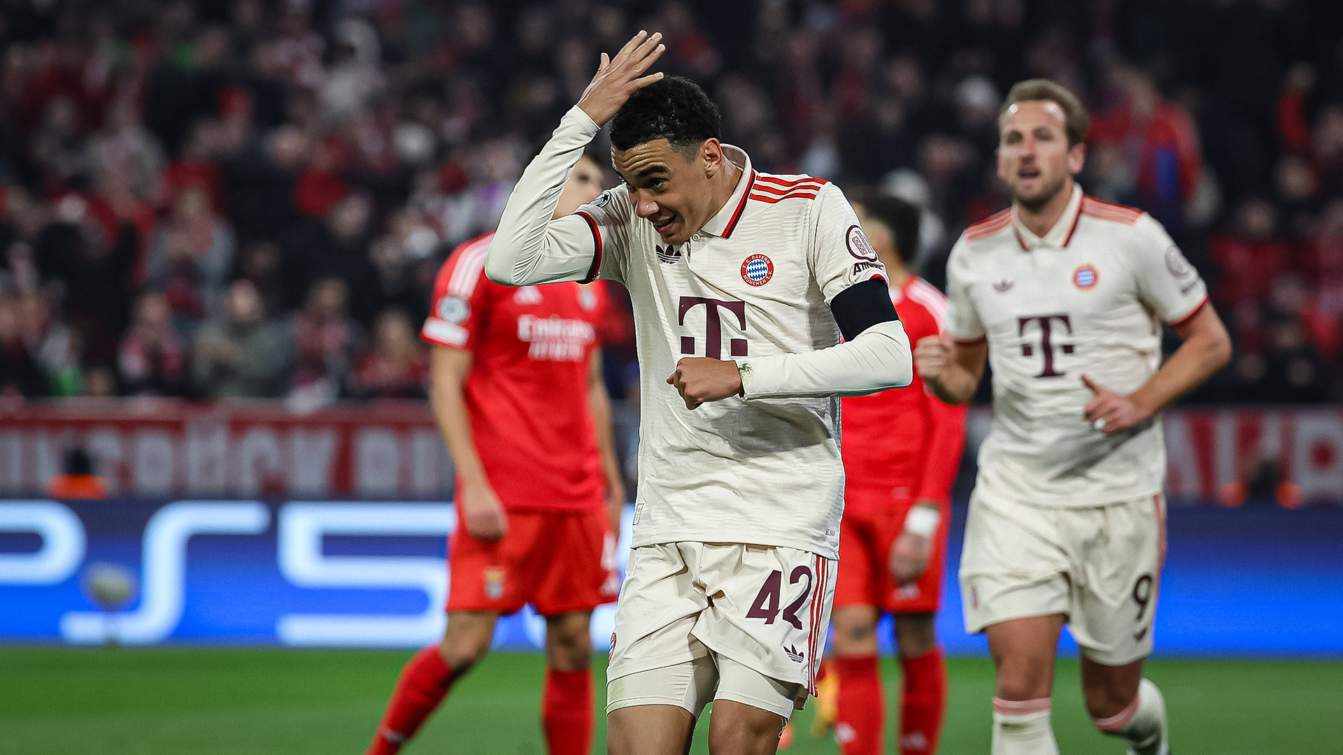 Jamal Musiala pats his head after his headed goal against Benfica.