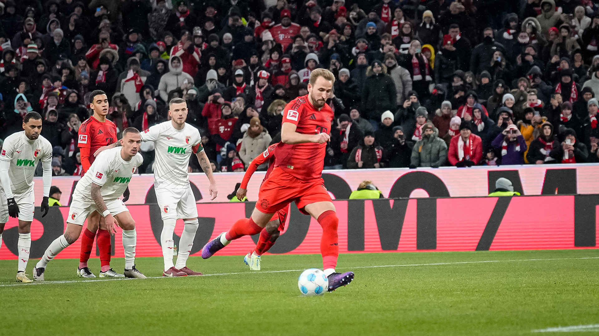 Harry Kane scores a penalty against Augsburg