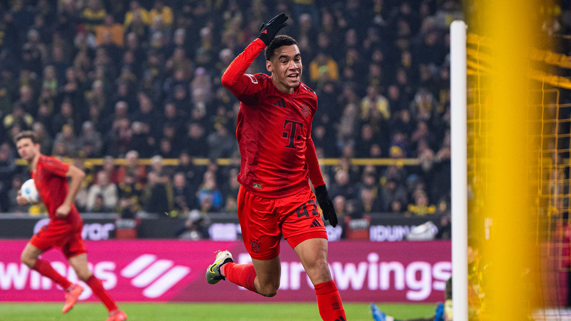 Jamal Musiala celebrates his header to make it 1-1 in Dortmund