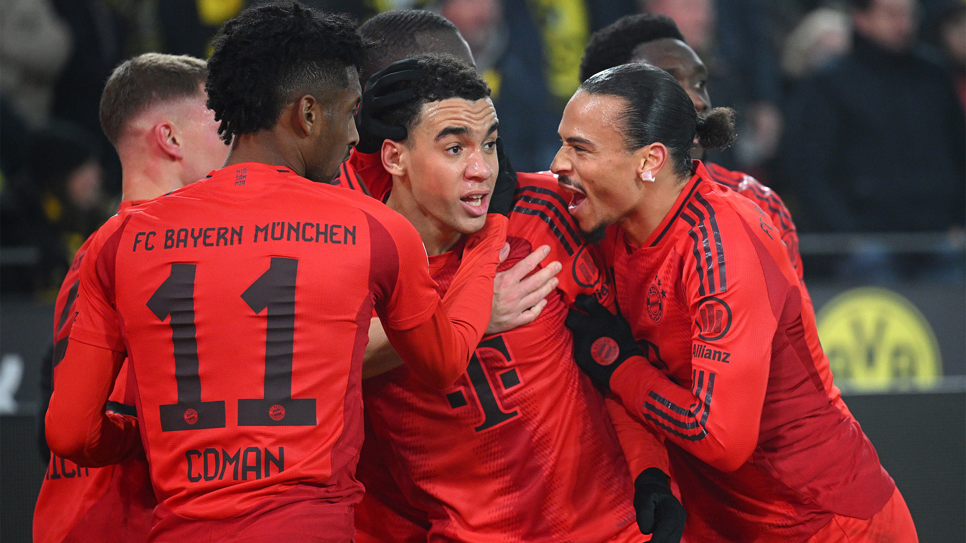 Jamal Musiala's team-mates congratulate him on his goal in Dortmund